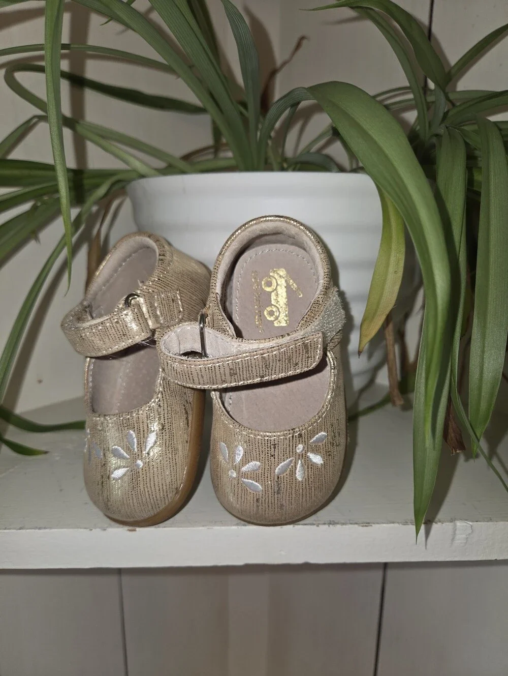 See Kai Run Metallic Gold Mary Janes with White Floral Accent
